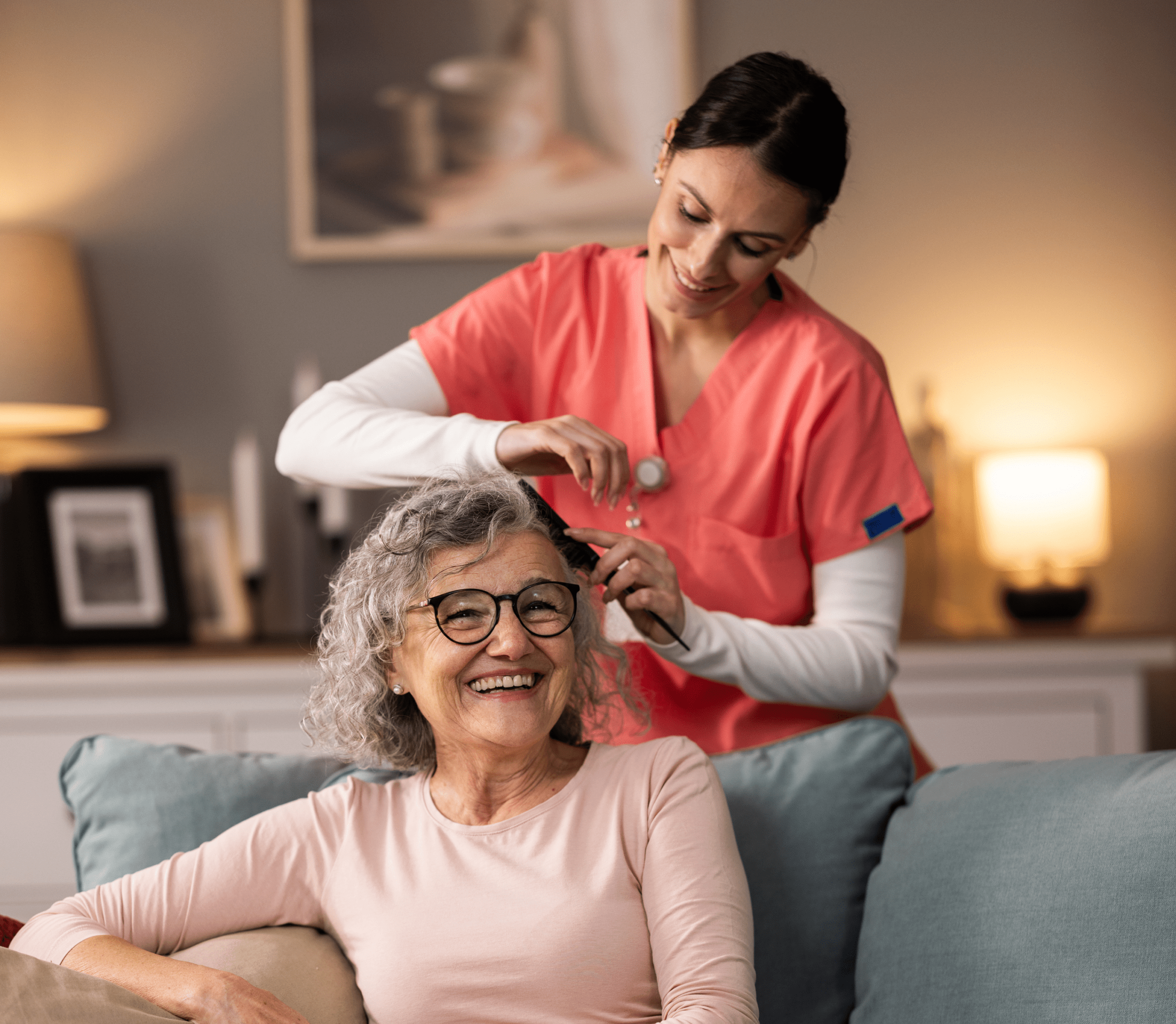 Nurse helping elderly woman at home